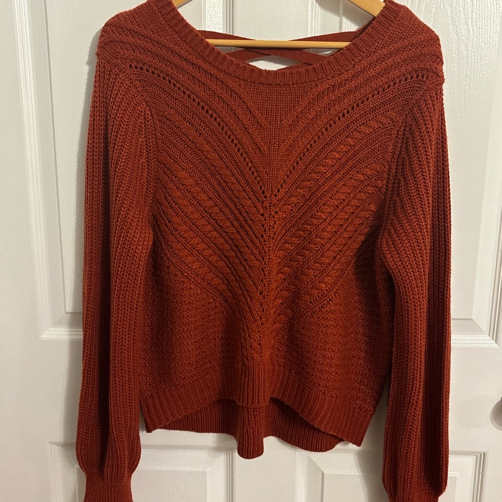Women’s knit sweater with crossback design.  Size XL